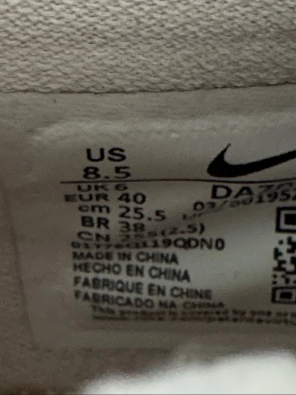 Nike Women’s Pink Low-Top Sneakers with Red Accent